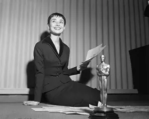Audrey Hepburn with Oscar Holding Telegrams