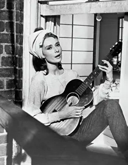 Audrey Hepburn Playing Guitar in Breakfast at Tiffany's