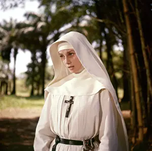 Prints of KISANGANI, DEMOCRATIC REPUBLIC OF CONGO, 1959: Audrey Hepburn photographed in Democratic Republic of Congo, during the filming of The Nun's Story, directed by Fred Zinnemann Elegance Personified – A Classic Art Print Collection: Audrey Hepburn Playing A Nun