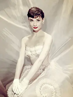 Prints of British actress Audrey Hepburn (1929 - 1993) poses for a portrait wearing a white dress in New York, New York, circa 1956. (Photo by TPLP/Getty Images) Elegance Personified – A Classic Art Print Collection: Audrey Hepburn Portrait