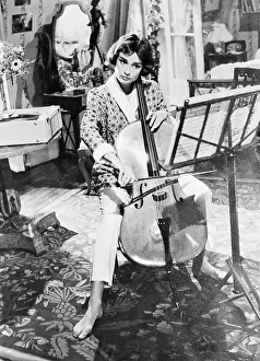Music Stand Prints: Audrey Hepburn Practicing Cello