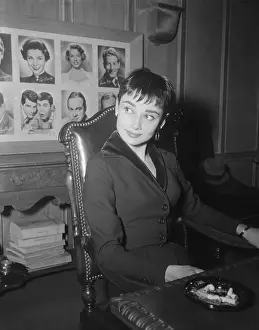 Audrey Hepburn Sitting at desk