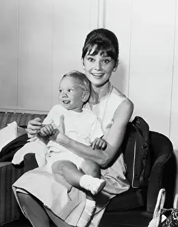 Sticking Out Tongue Prints: Audrey Hepburn with Son Sean Ferrer