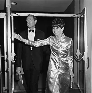 Prints of Actress Audrey Hepburn (1929 - 1993) and her husband, actor Mel Ferrer (1917 - 2008) attend the 39th Academy Awards at the Santa Monica Civic Auditorium in Santa Monica, California, USA Elegance Personified – A Classic Art Print Collection: Audrey And Mel At The Oscars