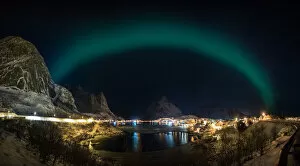 Aurora Borealis Collection: The aurora belt over Lofoten fishing village, Norway