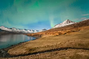 Images Dated 19th March 2016: Aurora borealis over the beautiful mountains fjord of Iceland