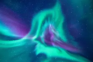 aurora borealis looks like phoenix display directly above the head in Iceland