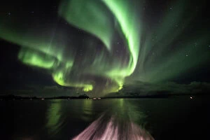 Aurora display in the wake of the Hurtigruten cruise ship, Norway
