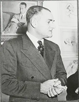 Author Alberto Moravia with Clasped Hands