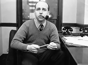 Author Jerome Weidman Smoking a Pipe