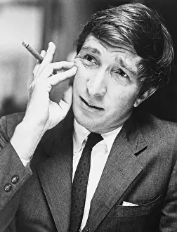 Author John Updike Smoking a Cigar