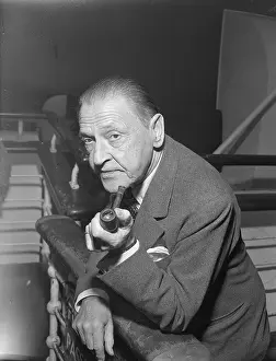 Author W. Somerset Maugham with a Pipe