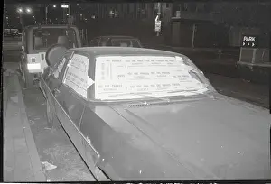 Automobile with Illegally Parked Stickers