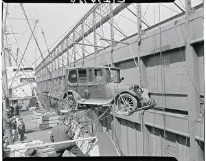 Automobile Being Lowered from Ship