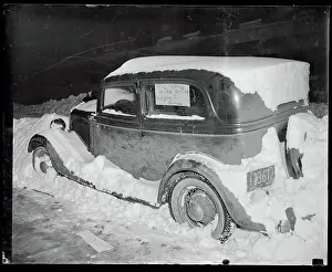 Automobile Sitting in the Snow