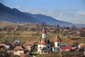 Autumn landscape of village and mountain range in background, Campulung Moldovenesc, Suceava County, Bucovina, Transylvania, Romania
