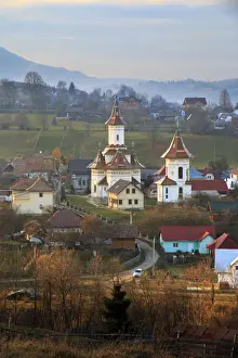 Autumn landscape of village and mountain range in background, Campulung Moldovenesc, Suceava County, Bucovina, Transylvania, Romania