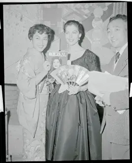 Ava Gardner Holding a Fan and Magazine
