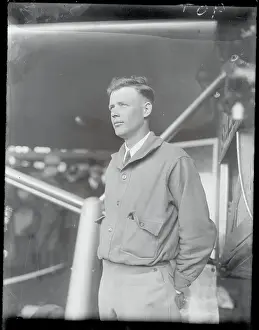 Aviator Charles Lindbergh Standing Next to Airplane