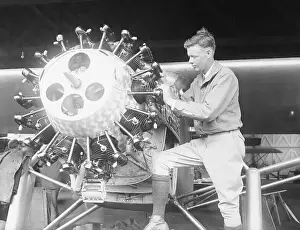 Aviator Charles Lindbergh Working on Airplane Parts