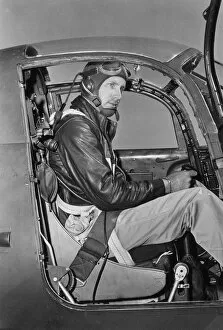 AVIATOR SITTING IN COCKPIT, CIRCA 1939