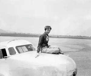 Burbank Prints: Aviatrix Amelia Earhart Posing on Airplane