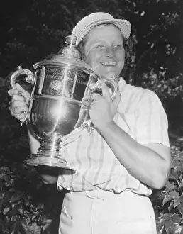 Babe Didrikson Holding Golf Trophy