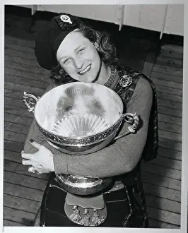 Babe Didrikson Hugging Golf Trophy