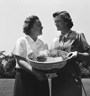 Babe Didrikson and Patty Berg Holding Trophy