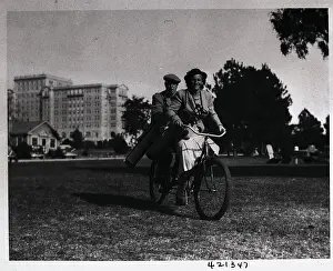 Augusta Prints: Babe Didrikson Riding Bicycle
