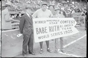 Babe Ruth Holing Sign