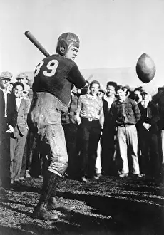 Babe Ruth Playing Football with Bat