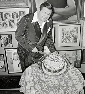 Babe Ruth Preparing to Cut His Birthday Cake