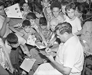 Autographing Prints: Babe Ruth Signing Autographs for Children