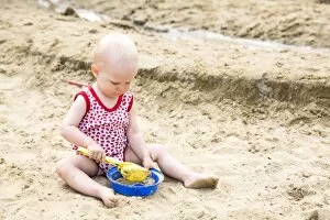 Images Dated 4th August 2014: Baby, 12-14 Months, playing in the sand