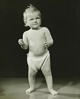 Images Dated 5th May 2006: Baby (12-15 months) in diaper standing in studio, (B&W)