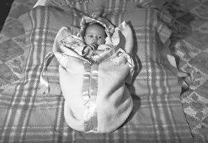 Lying On Back Prints: Baby (3-6 months) lying on blanket, (B&W), elevated view