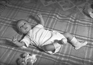 Lying On Back Prints: Baby (3-6 months) lying on blanket, (B&W), elevated view