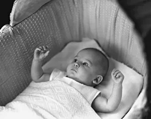 Images Dated 1st December 2006: Baby (3-6 months) lying in crib, (B&W), elevated view