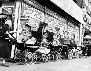 Storefront Prints: Baby Carriages Lined up Outside Store