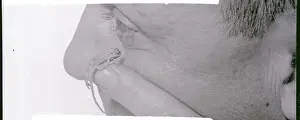 Baby Chameleon Sitting on a Zoo Attendant's Fingers