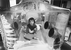 Plastic Prints: Baby David Plays In His Plastic Bubble
