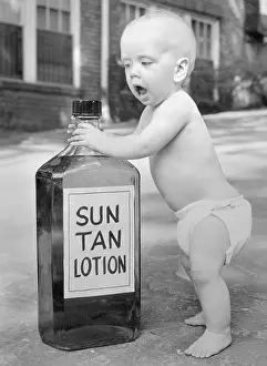 Birmingham Prints: Baby Posing with Bottle of Sun Tan Lotion