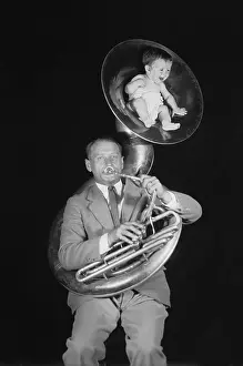 Infancy Prints: Baby Sitting in Tuba Horn