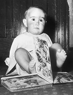 Thalidomide Prints: Baby Turning Pages with Toes