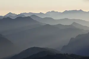 One After Another Prints: Backlit mountain ridges seen from Hochiss Mountain in Rofan, Maurach, Tyrol, Austria
