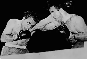 Prints of American boxer Max Baer (1909 - 1959) and Italian boxer Primo Carnera (1906 - 1967) during the bout for the Heavyweight Championship, Long Island City, New York, June 14, 1934 In the Ring: The Art of Boxing: Baer Vs. Carnera