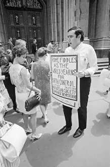 Bill Baird Holding Sign with Demonstrators