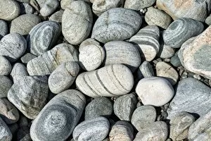 Banded and round gneiss, on the gravel beach, Geopark Scourie Bay, Sutherland, Scotland, United Kingdom, Europe