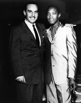 Prints of LOS ANGELES - JULY 7: Band leader Johnny Otis poses for a portrait with singer Sam Cooke on the set of the first episode of The Johnny Otis Show which was filmed on July 7, 1958 in Los Angeles The man known as the King of Soul: Bandleader With Legendary Singer